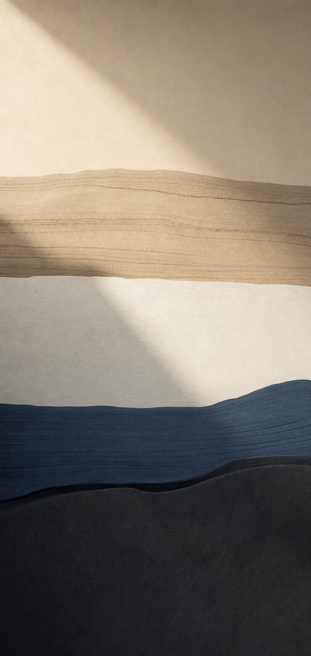 Abstract layered strata in sand, off-white, slate blue and charcoal.
